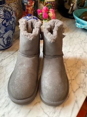 Pair of grey shimmer Bailey Ugg boots with satin bow detail, 8 m unworn